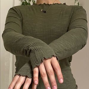 Long sleeved scalloped edge mock neck